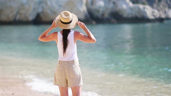 Young Beautiful Woman on White Tropical Beach.