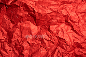 Crumpled red sheet of paper. Paper texture. Background for designers. Paper layout.