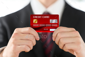 Hand of businessman with credit card