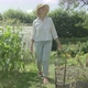 Senior caucasian woman walking through her garden - VideoHive Item for Sale