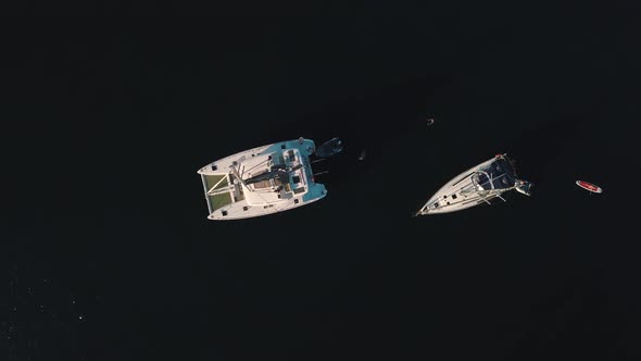 Aerial View on Anchored White Sailing Yachts, Catamarans and Boats Near Lipari Islands, Sicily