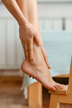 Closeup view of hands massaging foot