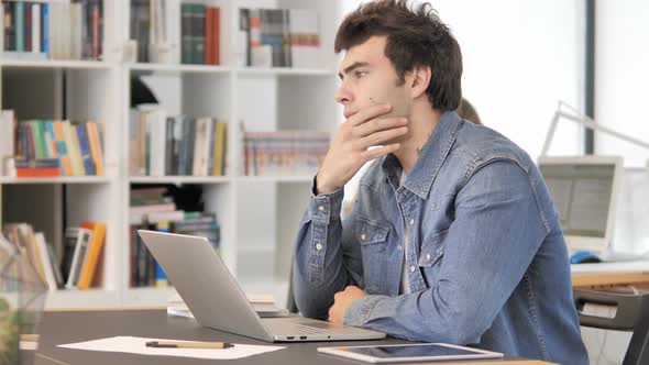 Pensive Creative Man Thinking at Work