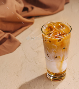 Iced coffee with ice cubes top view