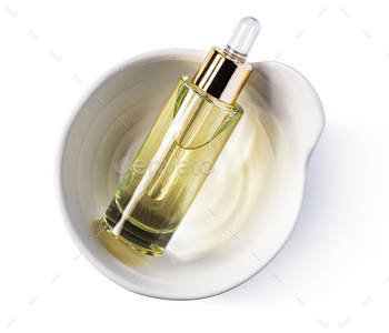 Essential serum Oil in cosmetic bottles with dropper