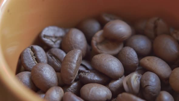 Coffee beans falling in a boul