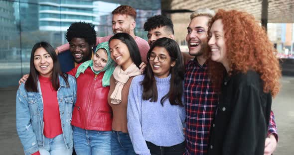 Young diverse people having fun outdoor laughing together - Diversity concept