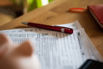 form 1040 for tax refund and pen on table