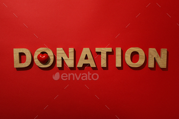 The word donation on a red background.