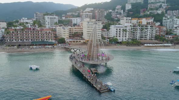 Tourists At The Puerto Vallarta Pier At Sunrise