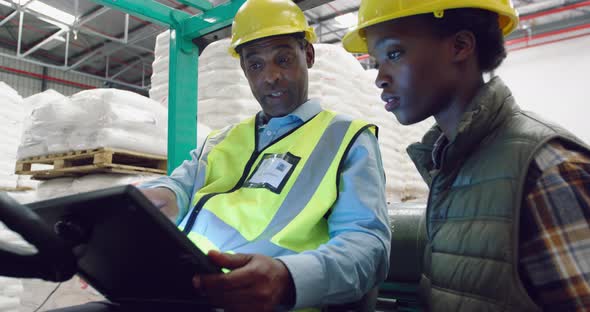 Workers interacting in a warehouse