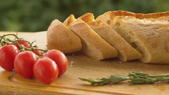 Tomatoes and bread on a cutting board