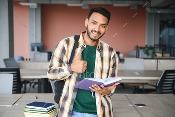 indian student with books at university