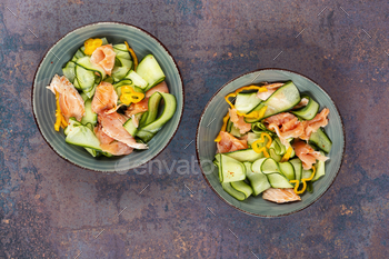 Fish salad with cucumber, diet concept.