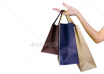 Woman carrying paper shopping bags isolated on white background. Adult woman hand hold three shopp