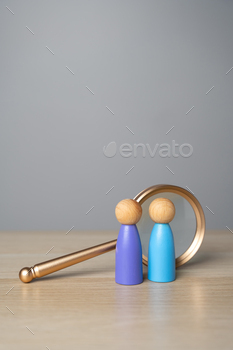Find people to work with. People figures near a magnifying glass.