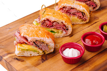 Mini sandwiches with ham and sauces