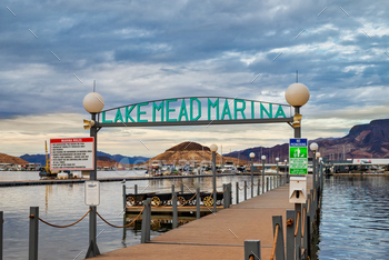 an image of a pier on a lake and a sign for lake mad marina