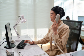 Bank Manager Talking on Phone