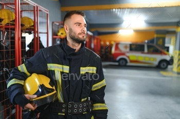 A firefighter puts on a fire uniform at the fire department