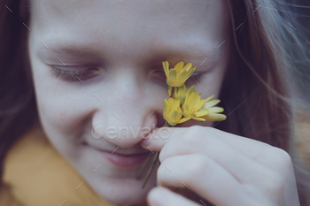 girl with yellow flowers