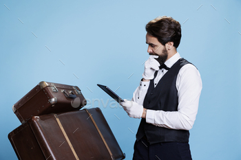 Hotel worker examining reservations