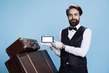 Professional bellman using mobile device