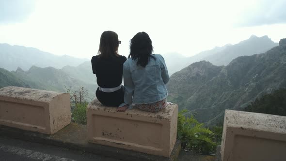 Two Beautiful Women Friends Looking at Beautiful Mountain View of Tenerife Island