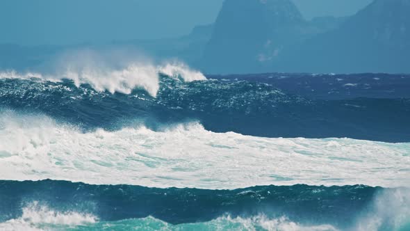 Breathtaking Slow Motion View of Azure Ocean and Giant Waves Crashing at Island