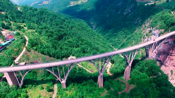 Drone Flight Above an Old Mountain Bridge Across The Canyon