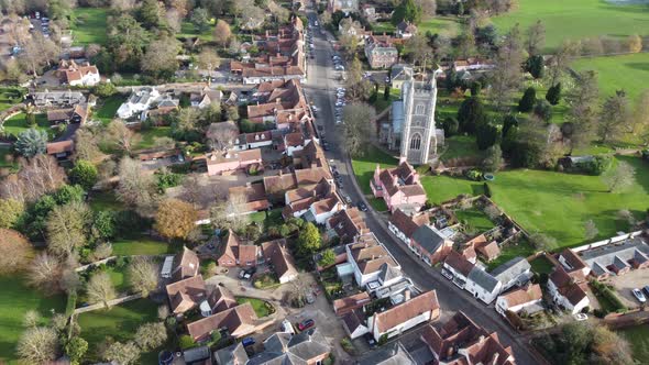 A drone flight over Dedham on the Essex/Suffolk border panning from the left to the village and chur