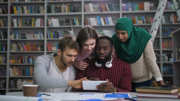 Students Checking Exam Grades Online on Tablet