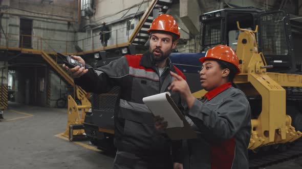 Workers Talking at Factory