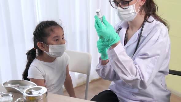 School Girl Visits Skillful Doctor at Hospital for Vaccination