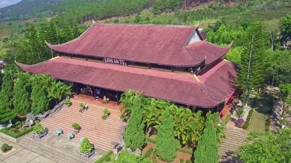 Flycam Shows Overview Ancient Pagoda Against Hills Blue Sky