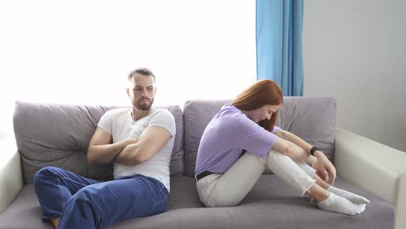 Depressed Wife Feeling Upset After Fight with Husband, Sit Back To Back.