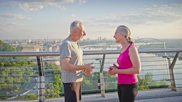 Happy Elderly People Meet for Joint Sports Giving High Five