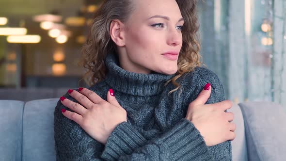 Woman Freezes in Grey Knitted Sweater Warms Up By Hugging Herself Seasonal Changes Low Temperature