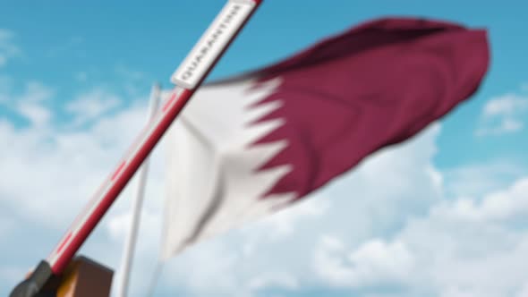 Barrier Gate with QUARANTINE Sign Being Closed at Flag of Qatar