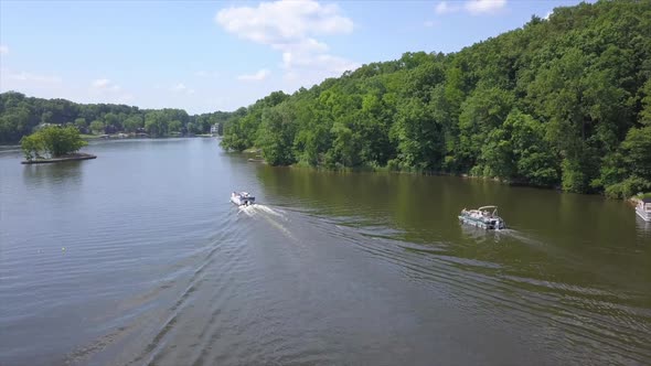 Drone Shot of two Pontoon Boats on Lake Shannon, Michigan