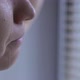 unrecognizable woman is crying near the window, a tear is rolling down her cheek - VideoHive Item for Sale