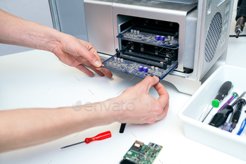 Unrecognizable Technician Working on Desktop Computer Hardware
