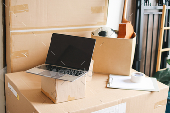 Laptop on Cardboard Boxes