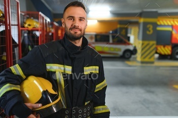 A firefighter puts on a fire uniform at the fire department