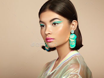Beautiful Korean Woman with large turquoise earrings