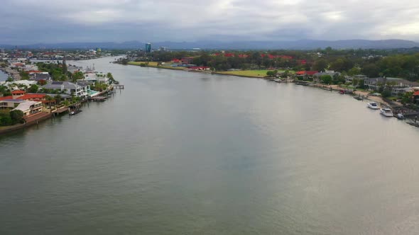 Peaefully flying down main canal on a cloudy day, Surfers Paradise Queensland Austrlia