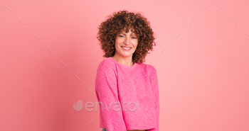 Smiling woman on pink background