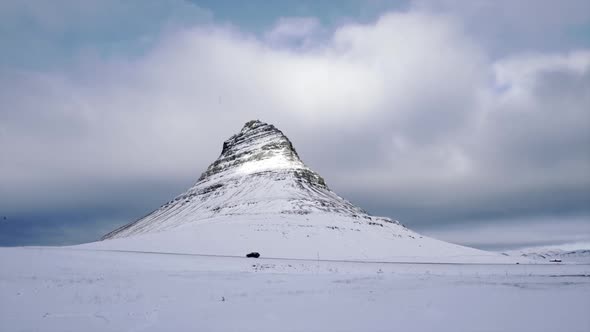 Car riding near snowy mountain