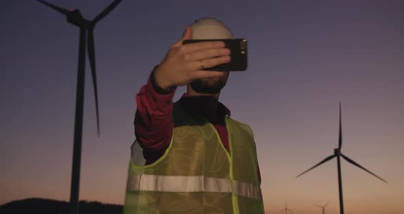 An Engineer at Sunset Uses Video Communication to Achieve the Best Results in the Work