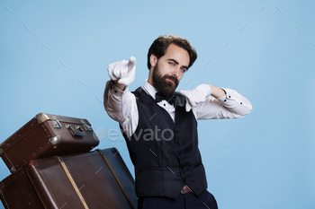 Smiling hotel concierge with gloves